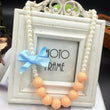 Girl or doll dress up Orange pearl necklace