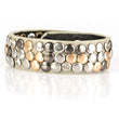 gray leather is sprinkled with silver, gunmetal, and gold studs and sporadic rhinestones that add just a hint of sparkle.