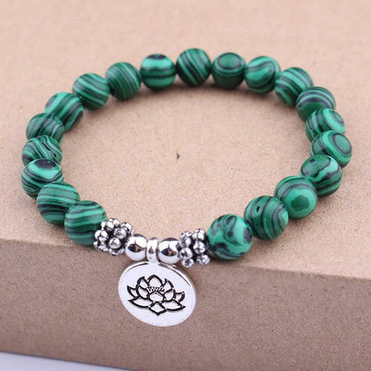 Mala Bead Bracelet is simplicity at its finest for a lady or guy.  The lotus / ohm charm connects our Solar Plexus - Green